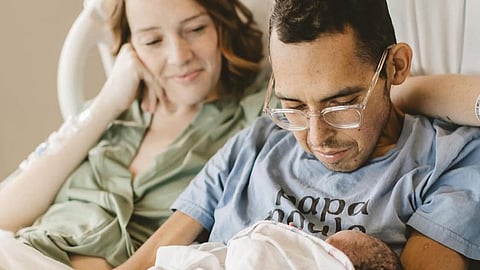 Tanner Martin with his wife and son