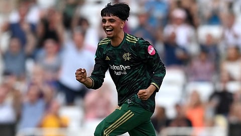 Farhan Ahmed celebrates after taking a wicket