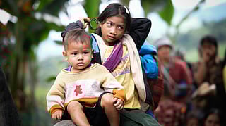 Elder kid with younger one