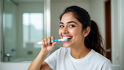 woman brushing teeth at night