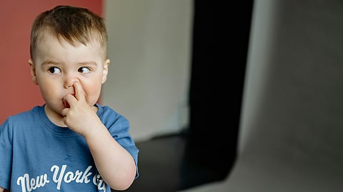 child nose-picking