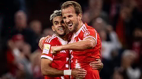 Harry Kane celebrates a goal with Luis Diaz