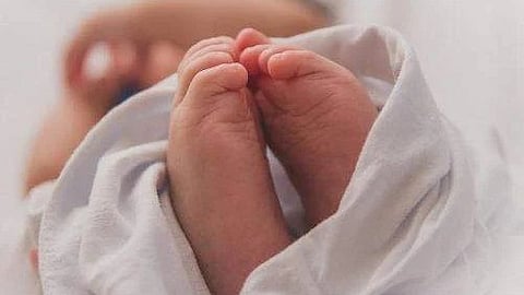 A four-day-old baby was found in an Ammathottil on the day of Thiruvonam