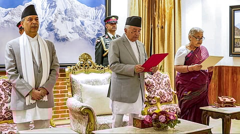 Nepal's President Ramchandra Paudel administers the oath of office to Sushila Karki as Prime Minister during a ceremony at the President's residence