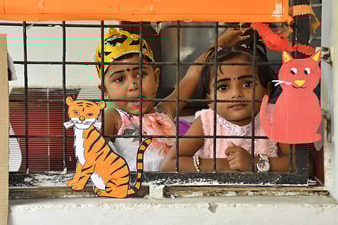 Two toddlers at an anganwadi in Thevarkad during the Praveshanotsavam
