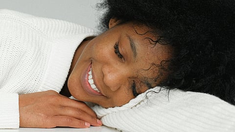 woman smiling while sleeping