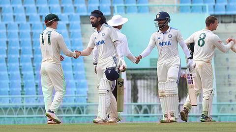 India and Australia players shake hands after the match