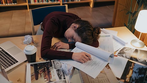 Woman sleeping on desk