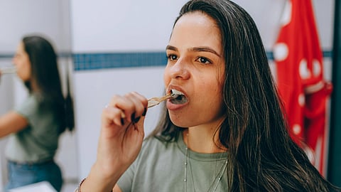 woman tooth brushing
