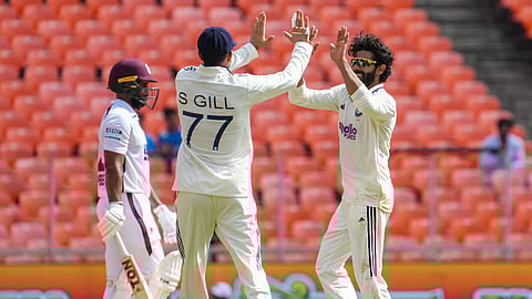 India's Ravindra Jadeja celebrates with captain Shubman Gill after taking the wicket of West Indies' John Campbell 