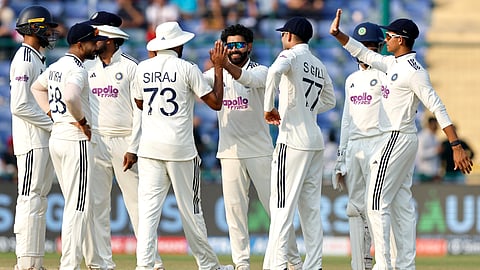 Ravindra Jadeja celebrates his wicket with his teammates