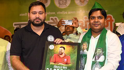 RJD leader and Leader of Opposition in Bihar Assembly Tejashwi Yadav with Ansari Mahapanchayat chief Naseem Nayyar Ansari during an event