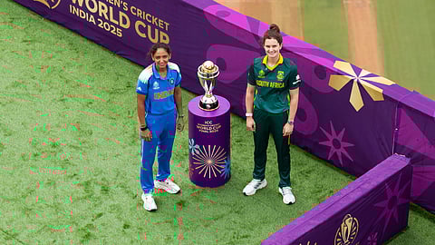 India's captain Harmanpreet Kaur and South Africa's captain Laura Wolvaardt pose with the trophy ahead of the ICC Women's World Cup 2025 final