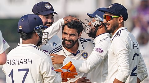 Ravindra Jadeja with teammates celebrates the wicket