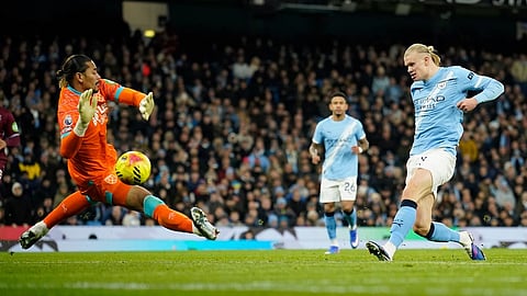 Manchester City's Erling Haaland, right, shoots and scores his sides third goal