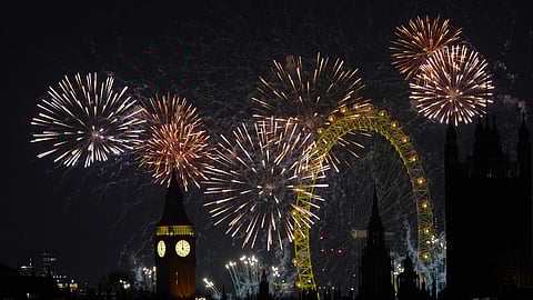 Fireworks light up the sky in central London to celebrate the New Year on Thursday
