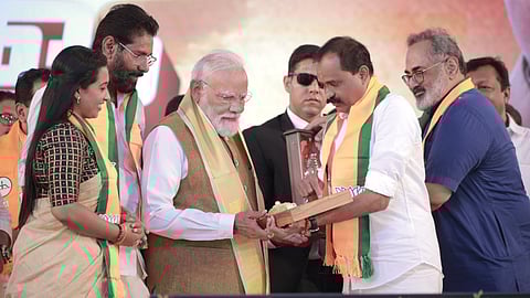V V Rajesh with Modi