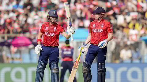 England's Jacob Bethell, left, celebrates his half-century with captain Harry Brook