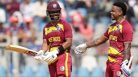 West Indies' Shimron Hetmyer, right congratulates captain Shai Hope for his fifty runs during the T20 World Cup cricket match