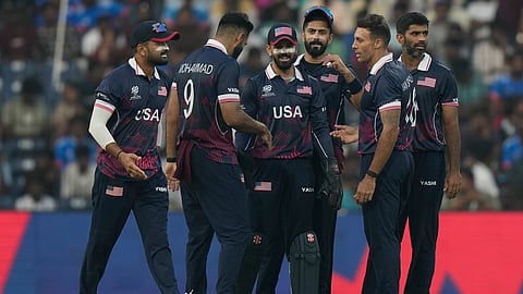 United States' Shadley Van Schalkwyk, second right, celebrates with teammates the wicket of Namibia's captain Gerhard Erasmus