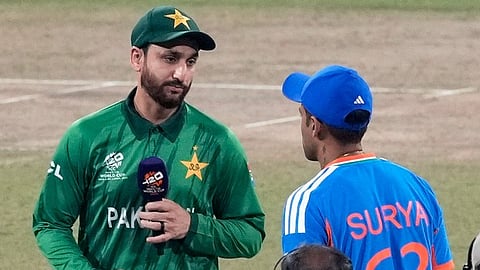 Pakistan's captain Salman Ali Agha, left, looks at India's captain Suryakumar Yadav after the coin toss of the T20 World Cup 