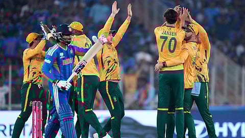 South Africa's Marco Jansen, back to the camera, celebrates with teammates the wicket of India's Tilak Varma