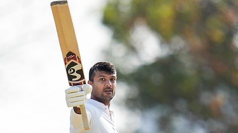 Karnataka's Mayank Agarwal celebrates after scoring a century 