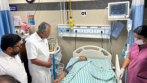 CM Pinarayi Vijayan near Minister Veena George