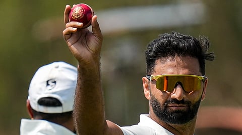 Jammu and Kashmir's Auqib Nabi shows the ball after taking a five-wicket haul