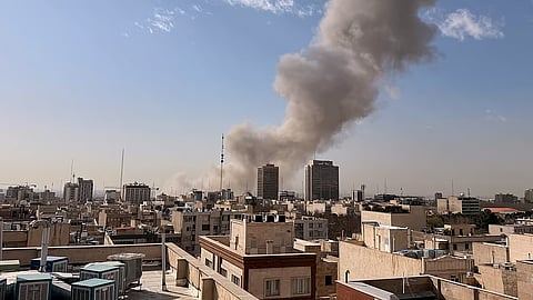 Smoke rises on the skyline after an explosion in Tehran, Iran, Saturday