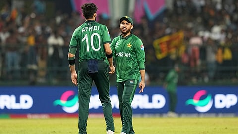 Pakistan's captain Salman Ali Agha, right, has a word with teammate Shaheen Shah Afridi during the T20 World Cup cricket match