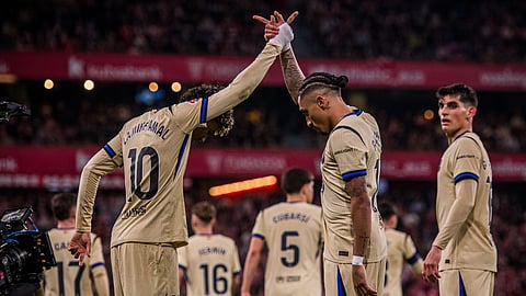 Lamine Yamal and Rafinha celebrate a goal
