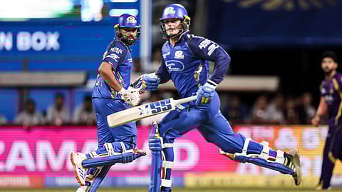 Mumbai Indians' Rohit Sharma and Ryan Rickelton run between wickets during Indian Premier League 2026 match against Kolkata Knight Riders