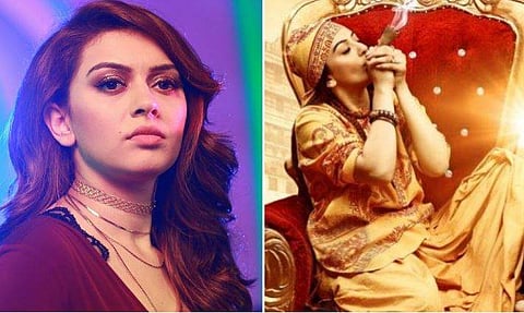 കാവി വസ്ത്രം അണിഞ്ഞ് ഹുക്ക വലിച്ച് ഹന്‍സിക; താരത്തിനെതിരേ കേസ്