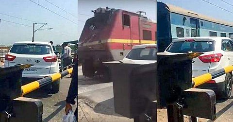 റെയില്‍വേ ഗേററിനും പാളത്തിനുമിടയില്‍ കാര്‍ കുടുങ്ങി: അത്ഭുതകരമായ രക്ഷപ്പെടല്‍, വീഡിയോ കാണാം