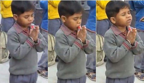 കൈകൂപ്പി കാര്യമായ പ്രാര്‍ത്ഥനയിലാണ്, വിരലുകള്‍ക്കിടയില്‍ കോലുമിട്ടായിയും; അസംബ്ലിക്കിടയിലെ കുസൃതി, വിഡിയോ വൈറല്‍