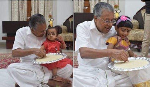 മുഖ്യമന്ത്രി എഴുത്തിനിരുത്തുന്നു / ഫെയ്‌സ്ബുക്ക് ചിത്രം