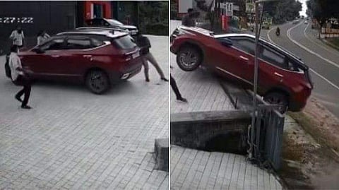 കാർ റോഡിലേക്ക് ഉരുണ്ടു പോകുന്നു / വീഡിയോ ദൃശ്യം