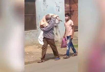 സംസ്‌കരിക്കാനായി മകളുടെ മൃതദേഹം ചുമലിലേറ്റി നടക്കുന്ന അച്ഛന്‍ വീഡിയോ ദൃശ്യം