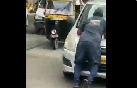 സുരക്ഷാ ഉദ്യോഗസ്ഥനെ കാര്‍ വലിച്ചിഴക്കുന്ന ദൃശ്യം