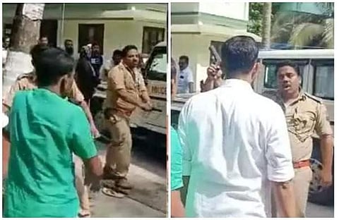 കവരത്തി എസ്‌ഐ സമരക്കാര്‍ക്ക് നേരെ തോക്കു ചൂണ്ടുന്നു/വീഡിയോ സ്‌ക്രീന്‍ഷോട്ട്