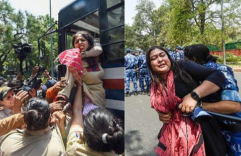 എഐസിസി ആസ്ഥാനത്തിനു പുറത്ത് മഹിളാ കോണ്‍ഗ്രസ് പ്രവര്‍ത്തകരെ പൊലീസ് ബലം പ്രയോഗിച്ചു നീക്കുന്നു/പിടിഐ