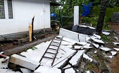 തൃശൂരില്‍ കഴിഞ്ഞ ദിവസമുണ്ടായ കാറ്റില്‍ തകര്‍ന്ന മതില്‍