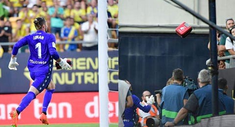 ഗ്യാലറിയിലേക്ക് മെഡിക്കല്‍ കിറ്റ് എത്തിക്കുന്ന കാഡിസ് ഗോള്‍ കീപ്പര്‍/ഫോട്ടോ: എഎഫ്പി