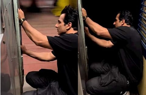 ട്രെയിനിന്റെ സ്റ്റെപ്പിൽ ഇരുന്ന് യാത്ര ചെയ്യുന്ന സോനൂ സൂദ്/ ചിത്രം; വിഡിയേ സ്ക്രീൻഷോട്ട്