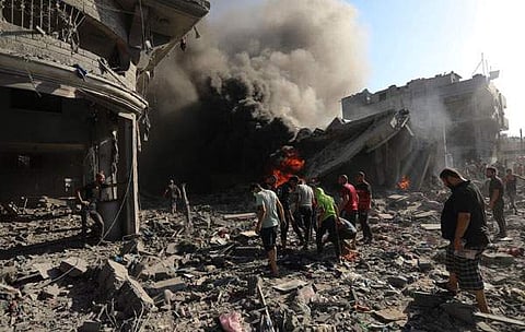 ഗാസ സിറ്റിയില്‍ ഇസ്രയേല്‍ നടത്തിയ വ്യോമാക്രമണത്തില്‍ തകര്‍ന്ന വീടുകളുടെ അവശിഷ്ടങ്ങള്‍/ ഫോട്ടോ: പിടിഐ