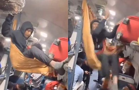 ട്രെയിനിൽ സീറ്റൊപ്പിക്കാനുള്ള  യുവാവിന്റെ പരിശ്രമം/ വിഡിയോ സ്ക്രീൻഷോട്ട്