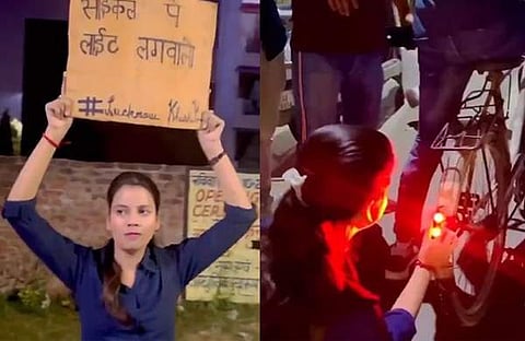 സൈക്കിളില്‍ യുവതി ബ്ലിങ്കര്‍ ലൈറ്റ് ഘടിപ്പിക്കുന്ന ദൃശ്യം