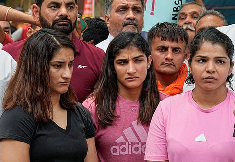 ഗുസ്തി താരങ്ങളായ വിനേഷ് ഫോ​ഗട്ട്, സം​ഗീത ഫോ​ഗട്ട്, സാക്ഷി മാലിക്/ പിടിഐ