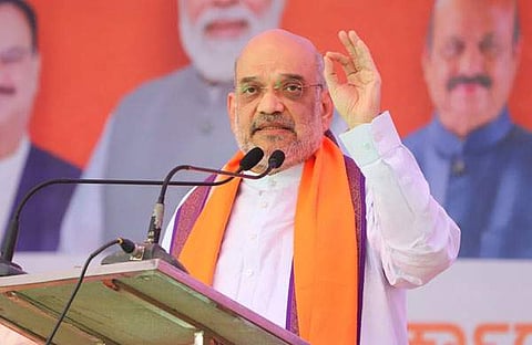 കര്‍ണാടകയിലെ തെരഞ്ഞെടുപ്പ് റാലിയില്‍ സംസാരിക്കുന്ന അമിത് ഷാ